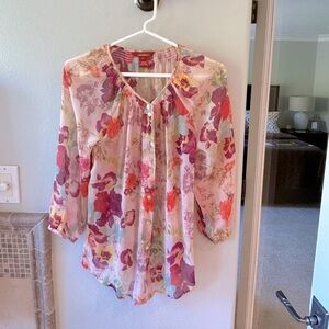 Sundance blouse beautiful colors and fabric. Size S runs big. Pinks corals sage.